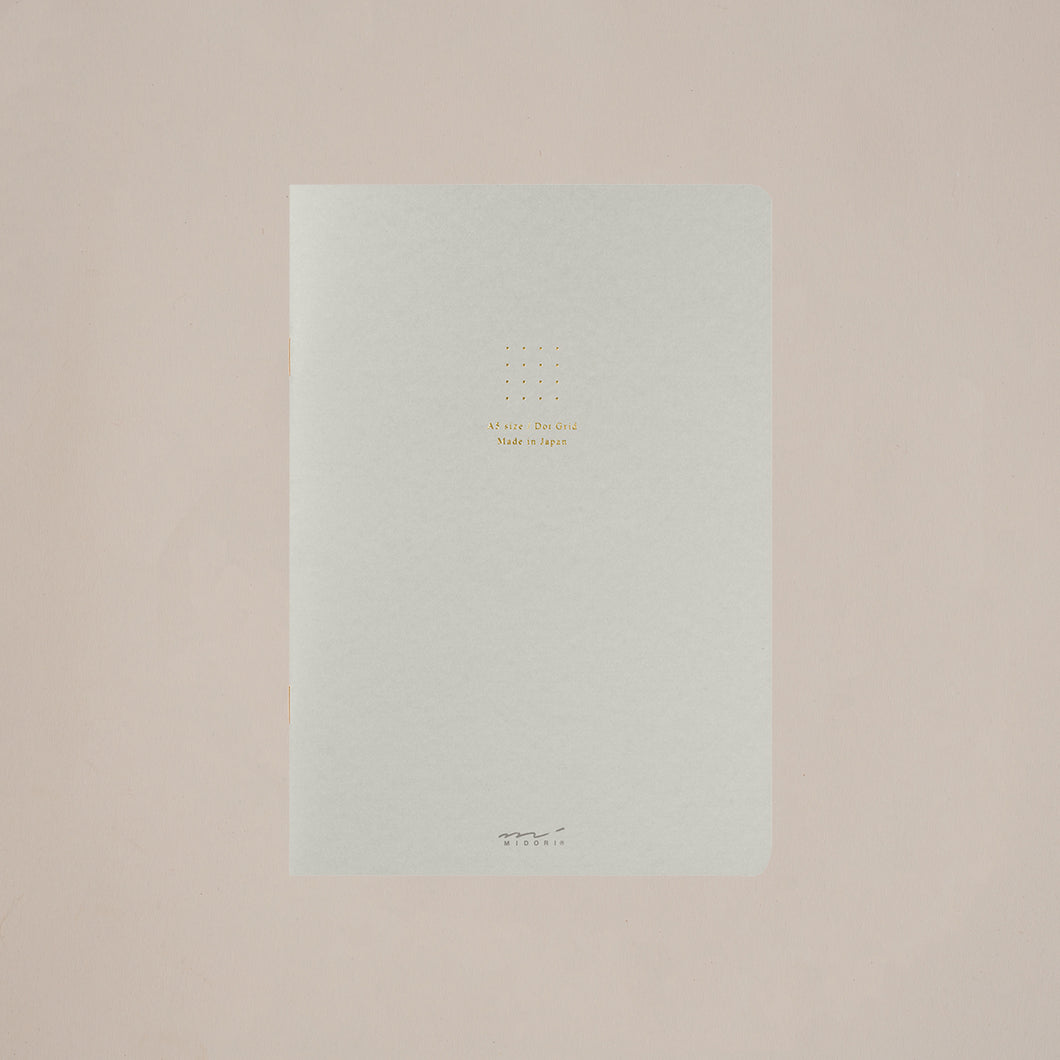 An elegant and functional dot grid notebook from Japanese stationer Midori in a pale grey tone.